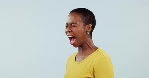 Stress, anxiety and black woman screaming in studio angry, frustrated or mistake trauma