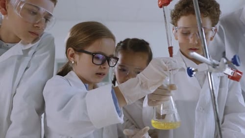 Enthusiastic Children Conduct Science Experiment in Laboratory