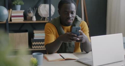 Young Adult Using Phone Indoors