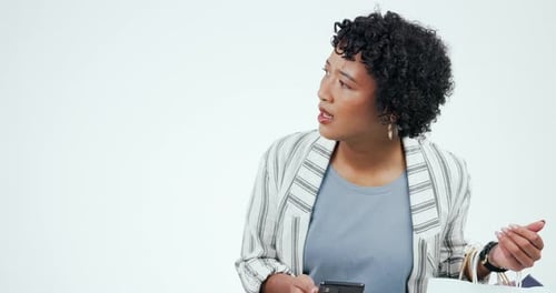 Shopping, anxiety and woman with phone call in studio annoyed waiting for a taxi on white