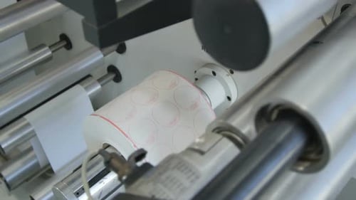 Closeup Roboti Machine Winds Paper Tape Rolls at Workshop
