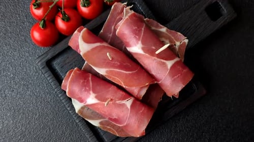 Meat, ham, jamon, or prosciutto sliced for breakfast bruschetta. Sliced ham, jamon, or prosciutto