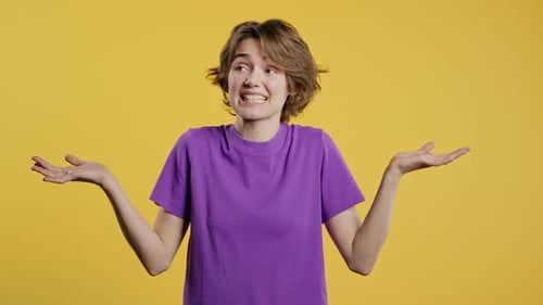 Confused Pretty Woman Shoulders Up Can't Help Makes Gesture of I Dont Know Difficult Question Guilty
