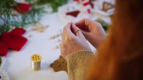 Closeup Redheaded Female Girl Hands Creating New Year Xmas Decoration for Christmas Tree Rear View