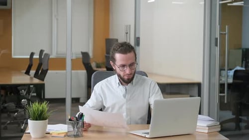Businessman Checking the Marketing Report