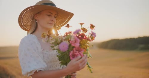 Woman with Flowers at Sunset