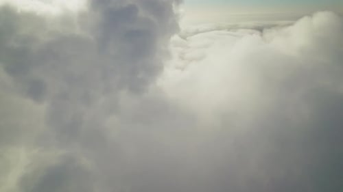 Cloudscape Forming Above Industrial Area Covered By Snow