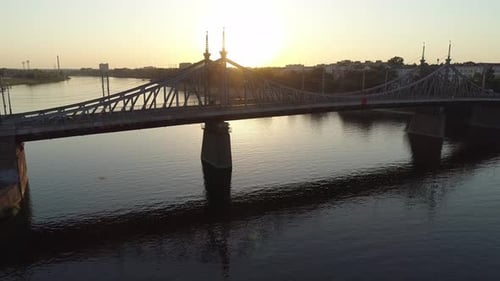 Aerial View of the Road Bridge Across the River at Sunset Beautiful Cityscape