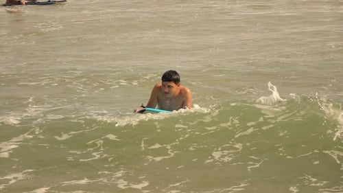 Teenage Boy Surfing On Board In Sea, Super Slow Motion 240fps