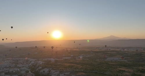Aerial Cinematic Drone View of Colorful Hot Air Balloon Flying Over Cappadocia
