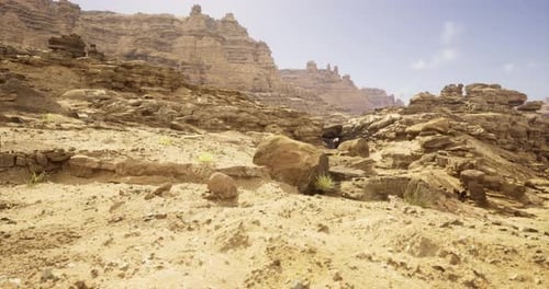 Rocky Landscape Showcasing Barren Terrain in a Desert Region Under Blue Sky