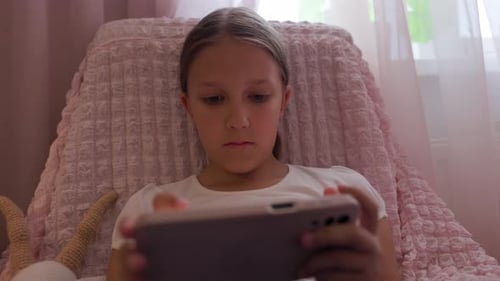Young Girl Using Tablet Indoors at Home