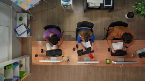 Call Center Support Department Top View of the Desk with Computers Workers Talking with Clients
