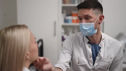 Doctor Examines Patient in Medical Clinic Consultation