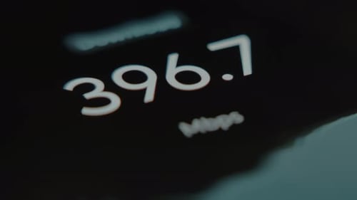 Changing Numbers Showing the Internet Speed in Mbps During a Test on a Smartphone Macro View