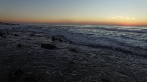 Ocean waves at sunset