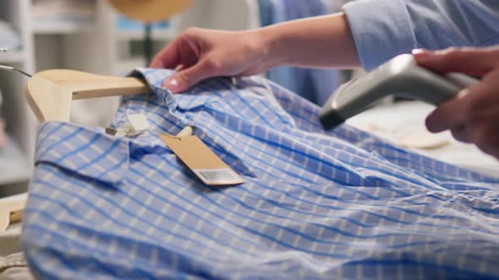 Clothing Manufacturer Uses An Industrial Scanner To Scan Tags On ...
