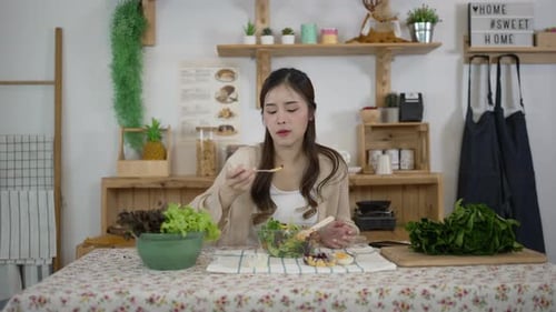Woman Enjoys Healthy Salad at Home in Daylight