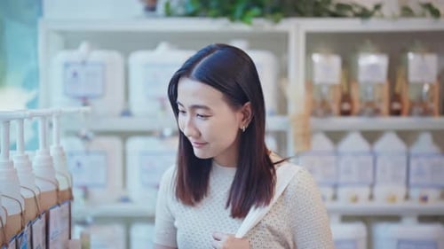 Portrait of a young woman in a zero waste refill store
