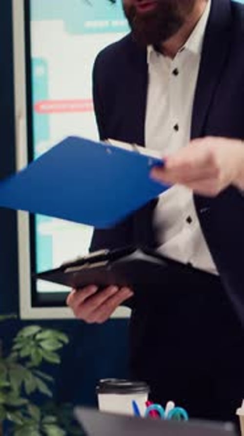 Man Giving Presentation at Corporate Office Meeting