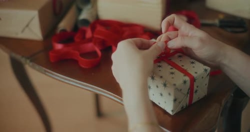 Gift Wrapping with Red Ribbon for Holidays