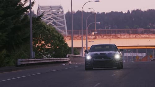 Portland, Oregon Circa-2018. Black Sports Card Driving on Street Auto
