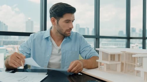Architect Working on a Building Design in Office