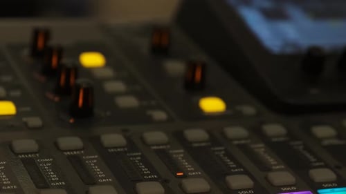 Working on a large sound mixer