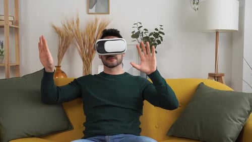 Young Man Experiencing Virtual Reality at Home