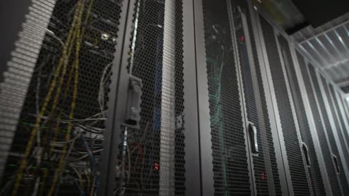 Server Rack Rows with Network Ports and Cables in Data Center