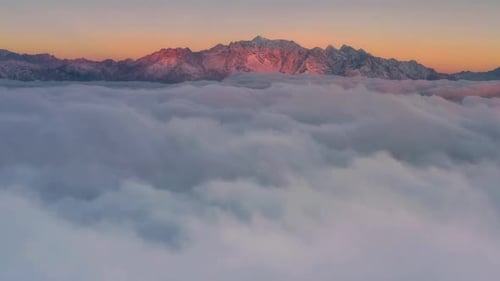 Spectacular Aerial View of Mountains Above Cloudscape