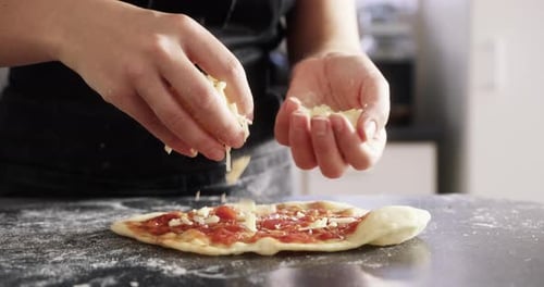 Person, hands and cheese on pizza dough for prepare raw ingredient for baking