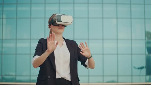 Woman Engineer Wearing Virtual Reality Headset Works and Gestures in VR