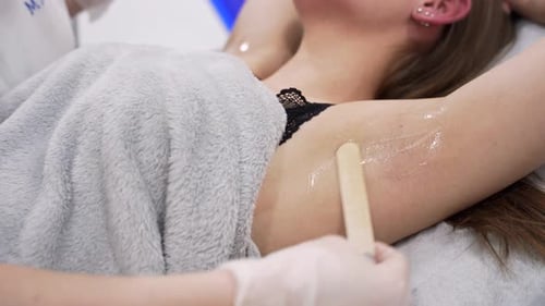 Close Up Shot of Doctor Puts Special Gel on Female Patient Aarmpit Before Lazer Hair Removal