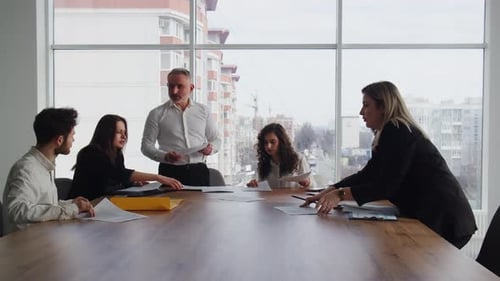 Business Team Meeting in Modern Urban Office