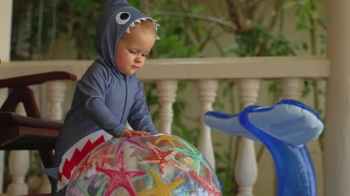 Baby Shark Plays with Beach Ball Outdoors
