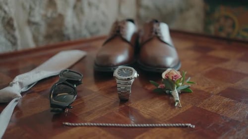 Groom accessories arrangement on wooden table
