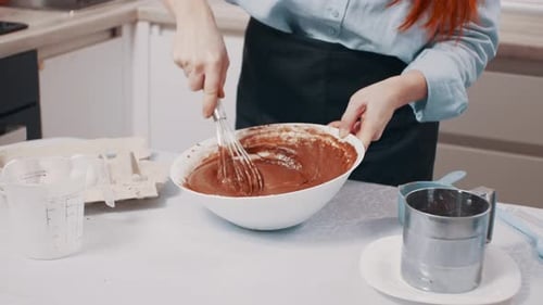 A Woman Makes Chocolate Dough