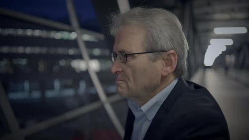 An Introspective Senior Man in a Modern City at Night Showcasing Wisdom and Contemplation