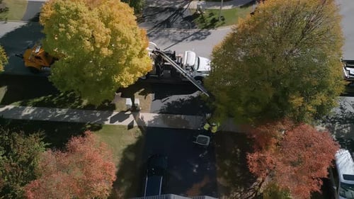 Wide Aerial Shot of Street Pavement Machinery in Suburban Region