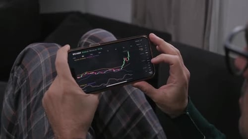 Trader Using Technical Analysis at Stock Market Candlestick Patterns Analyzing Market Trends