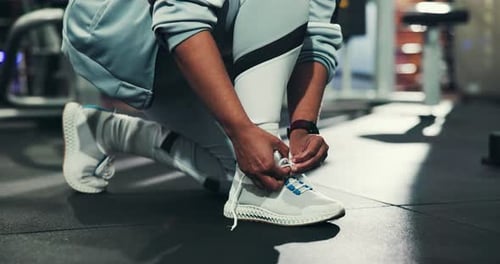 Hands, shoes and tying laces in gym for fitness, run or start exercise routine for health
