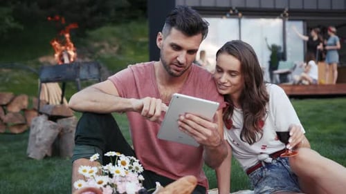 NEW YORK April 5 2017 Pretty Young Lovers in Casual Outfits Actively Talking Drinking Wine and Using