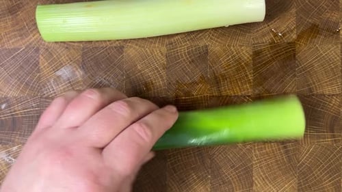 Slicing Fresh Leeks on a Cutting Board
