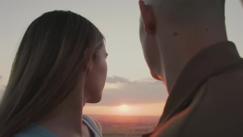 Romantic Couple Embracing at Sunset in Rural Setting