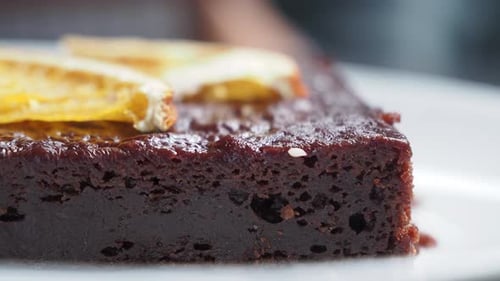 Decadent Chocolate Brownie with Candied Oranges Close-Up