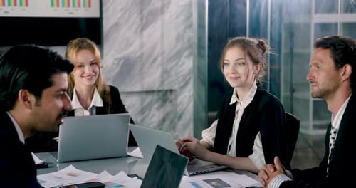 Diverse Team Meeting in Bright Modern Office