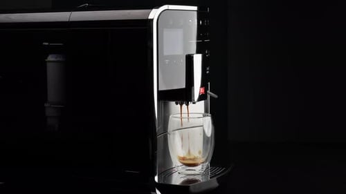 Coffee Machine Pours Fresh Espresso into Glass Cup