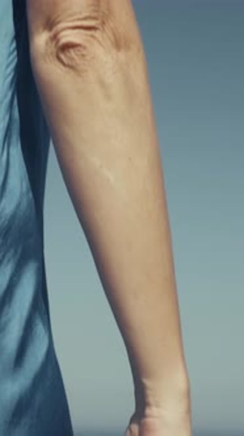 Wind Moving The Dress Of The Woman At The Sea