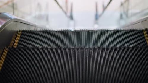 Close Up of Moving Escalator Indoors